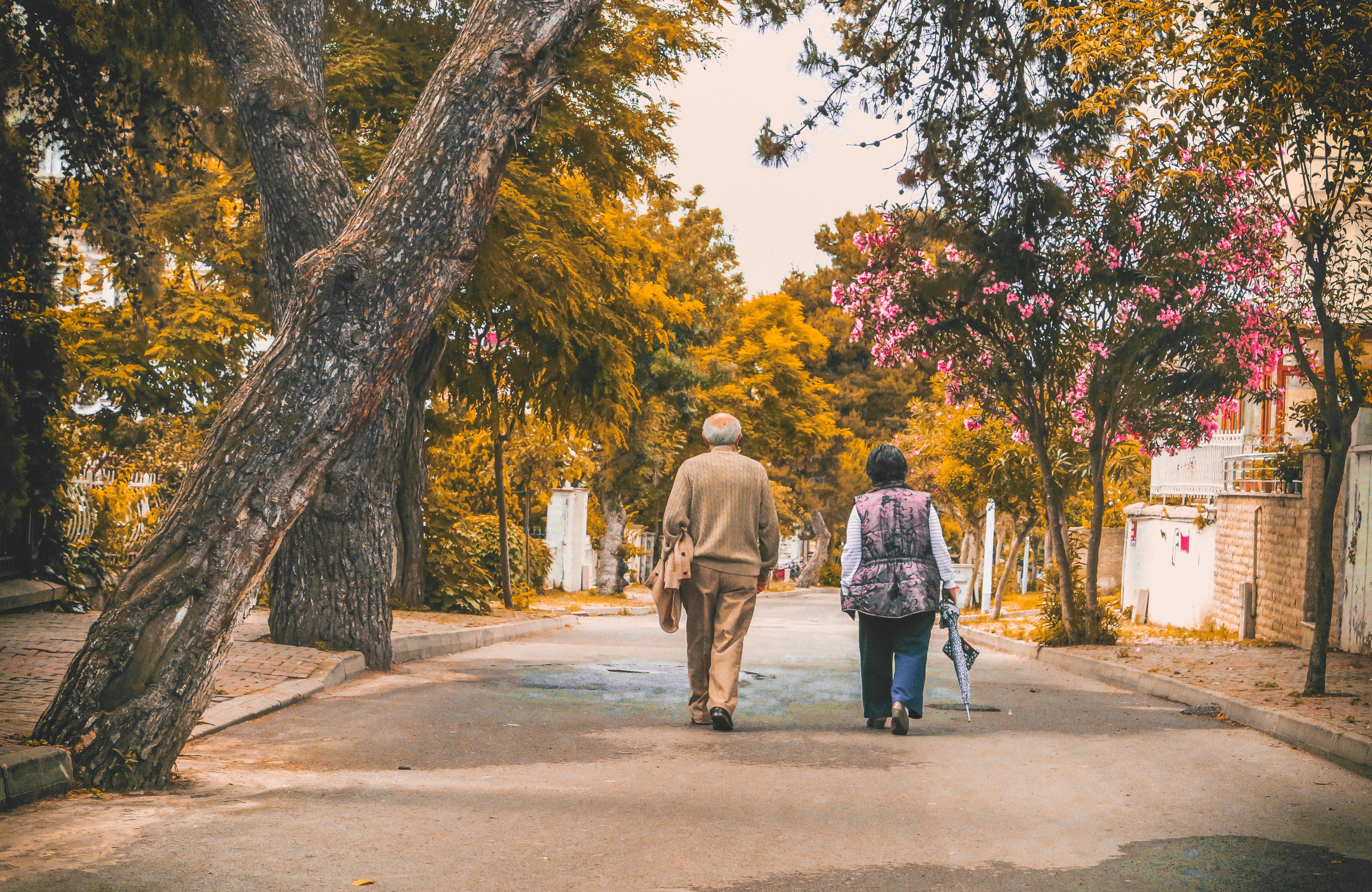 man-and-woman-walking-on-the-street-2385569